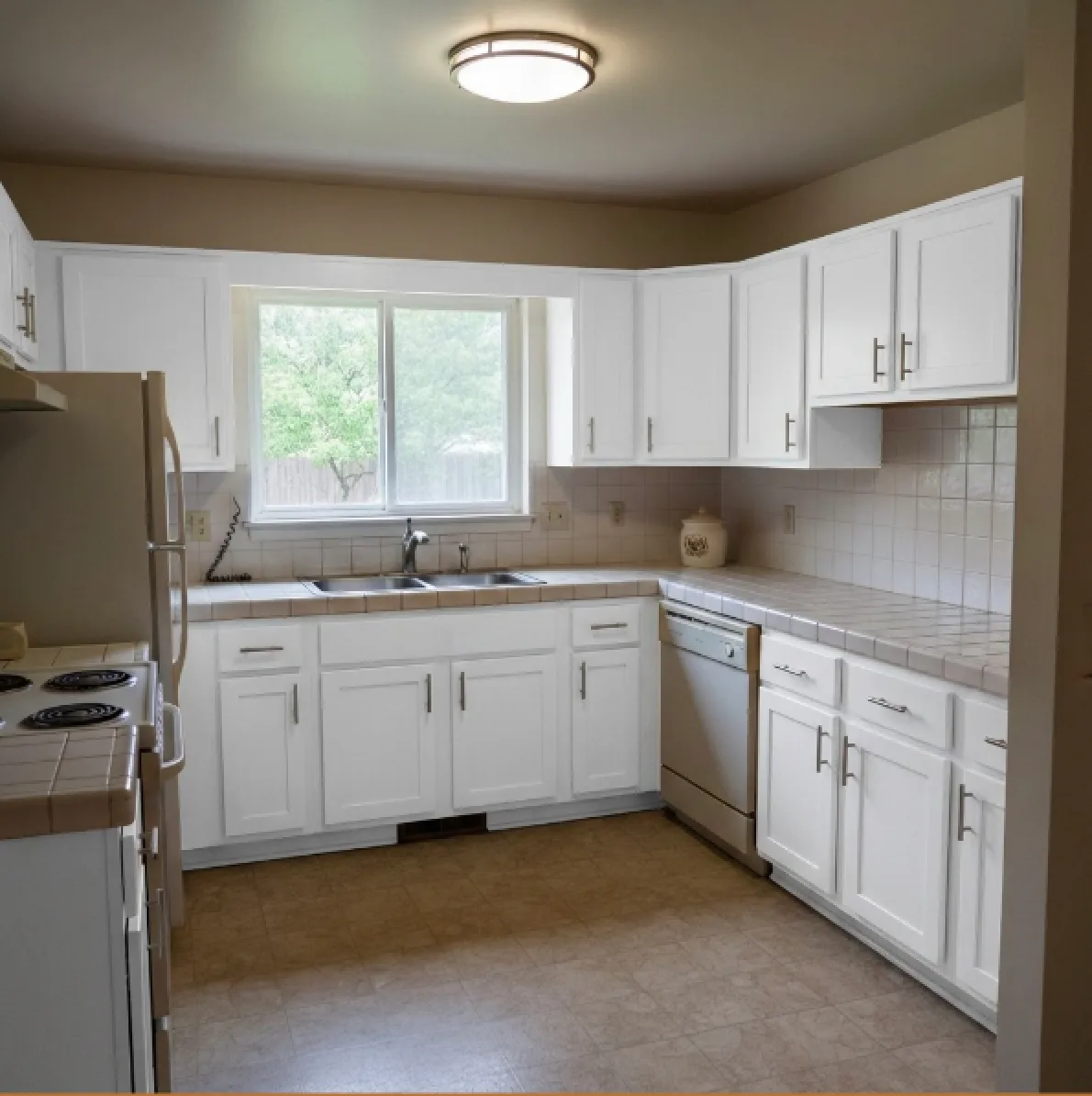 Kitchen after cabinet refacing - modern white cabinets